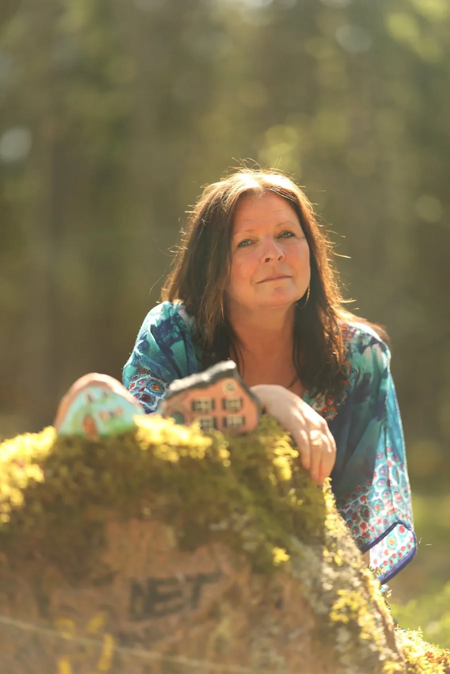 Mia Ottosson — spiritual guide, medium and energy healer, outdoors in soft forest light